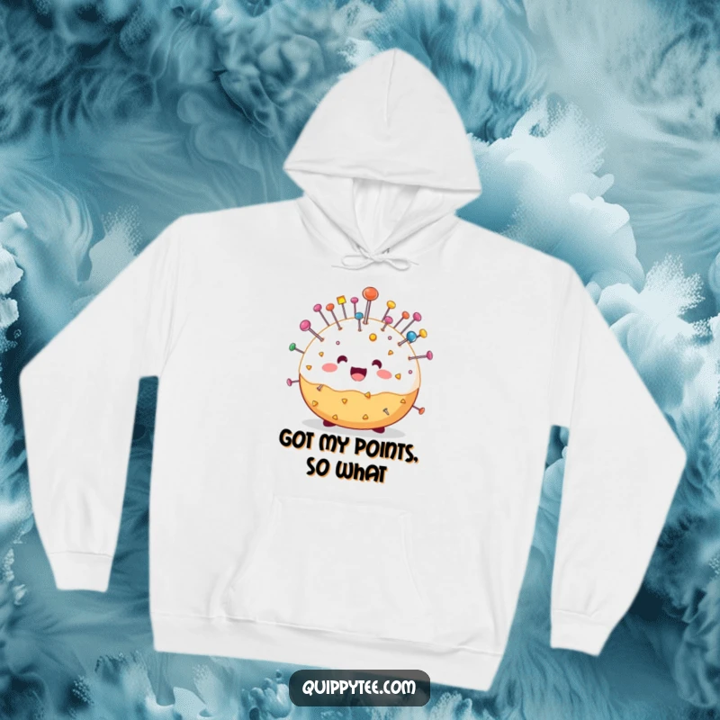 Funny hoodie with a happy pin cushion character loaded with colorful pins, providing warmth and humor for sewing and crafting enthusiasts.