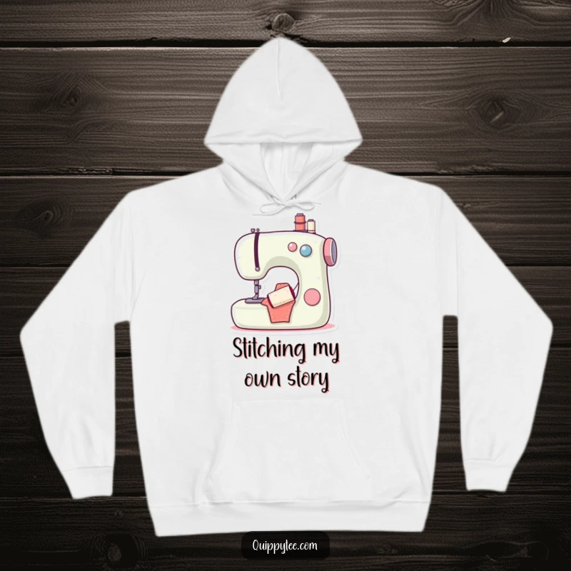 Funny hoodie featuring a content sewing machine and a cheerful bobbin, offering warmth and humor for dedicated crafters and stitch lovers.
