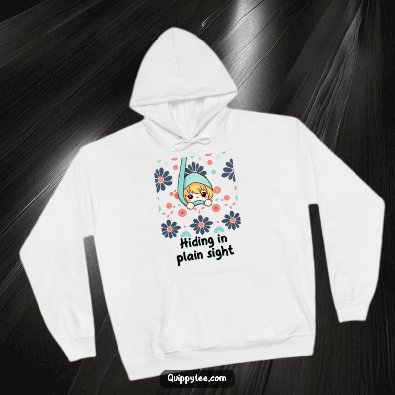 Funny hoodie with a delightful kawaii character peeking from behind a textured, patterned fabric, embodying playful curiosity and warmth.