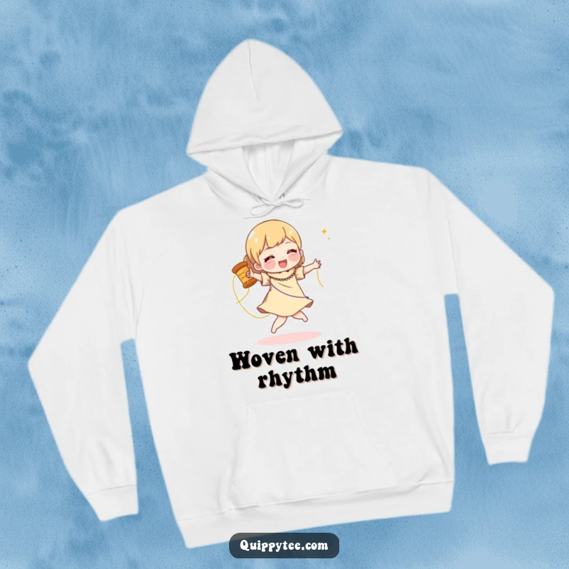 Funny hoodie with a character doing a joyful dance with a spool of shimmering thread, perfect for cozy creative inspiration.
